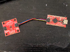 Two red modules plugged together to provide access to a security coprocessor over usb c